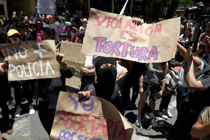 Demonstrators in Mexico City protest on August 12 the recent rape of two teenage girls