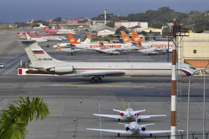 A Russian Ilyushin Il-62M Air Force plane, one of the two Russian military planes that arrived with troops and equipment to Venezuela in March, sits on the tamrac at Simon Bolivar International Airport on March 28, 2019 in Maiquetia Venezuela