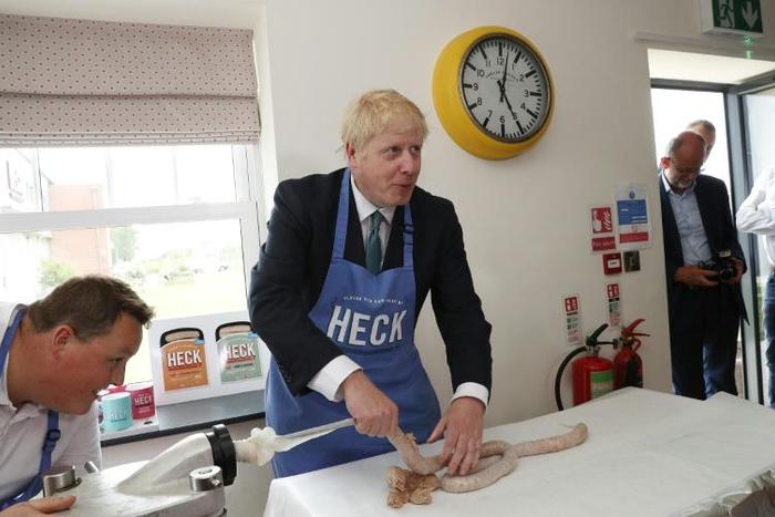 Boris Johnson (C) says optimism and constructive ambiguity can get Britain out of the EU on favourable terms