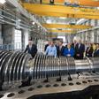 The German economy shrank in the second quarter and could be at risk of recession but German Chancellor Angela Merkel (centre) sees no immediate need for a stimulus package despite strong government finances