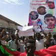 Sudanese protesters march with a poster bearing the portraits of victims, who were shot dead for protesting against a shortage of bread, during a demonstration in the central city of Al-Obeid on July 31, 2019.Hundreds of protesters marched through a ce...