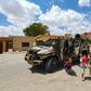 Libyan children play next to a burnt out vehicle belonging to forces loyal to strongman Khalifa Haftar in Gharyan, 100 kilometres (60 miles) southwest of Tripoli, earlier this year; the UN has called for a humanitarian truce