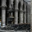 Instead of crowds, only a few dozen specialist workers wearing white protective overalls, hard hats and masks could be seen carrying out painstaking work to make the building safe