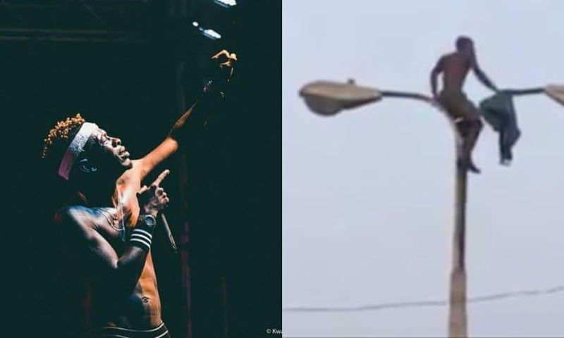 Shatta Wale fan climbs a light pole to watch him perform