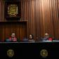 US Supreme Court President Juan Jose Mendoza (C) reads a statement rejecting the return to the Inter-American Treaty of Reciprocal Assistance (TIAR) on July 26