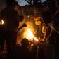 Protesters stand around a fire at a vigil against the result of the May 21 presidential vote in Lilongwe on July 4, 2019. Malawi's re-elected President Peter Mutharika has condemned the protests