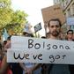 Protesters with a banner that reads "Bolsonaro we've got beef!" block a street at a climate change demonstration in London on August 23, 2019; Finland is now weighing a Brazilian beef ban over Amazon fires