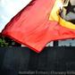 An East Timorese student waves his national flag during a 2016 protest about Australia's intentions in the Timor Sea