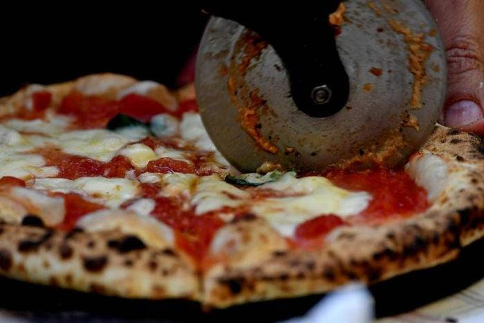 A new South African pizza made with cannabis oil won't maker diners high, says the restaurant chain's supplier, but it might confer calming effects when eaten