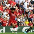 Liverpool's Egyptian midfielder Mohamed Salah (C) shoots to score his second goal, Liverpool's third during the English Premier League football match between Liverpool and Arsenal at Anfield in Liverpool, north west England on August 24, 2019.