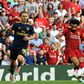 Liverpool's Egyptian midfielder Mohamed Salah (C) shoots to score his second goal, Liverpool's third during the English Premier League football match between Liverpool and Arsenal at Anfield in Liverpool, north west England on August 24, 2019.