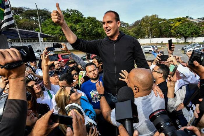 Eduardo Bolsonaro, pictured in Sao Paulo in 2018, said that when he was younger he washed plates with Mexicans and Peruvians in a kitchens in Maine and Colorado