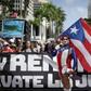 People march in San Juan, Puerto Rico on July 25, 2019, one day after the resignation of Governor Ricardo Rossello