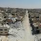 The strategic northwestern town of Khan Sheikun, which Syrian government forces entered on Wednesday, has ben heavily damaged by air strikes and shelling and the great majority of its residents have fled