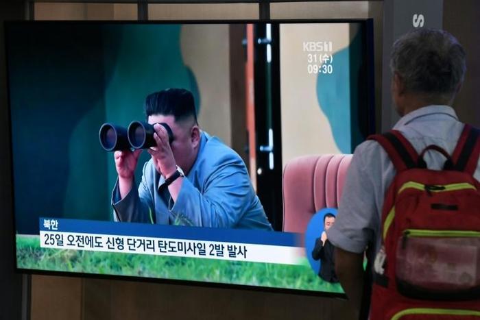 A television at a railway station in Seoul on July 31 shows footage of North Korean leader Kim Jong Un watching a previous missile launch