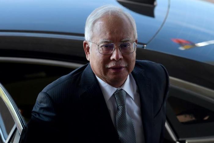 Former prime minister Najib Razak has been hit with dozens of charges linked to the 1MDB scandal, and has been on trial since April