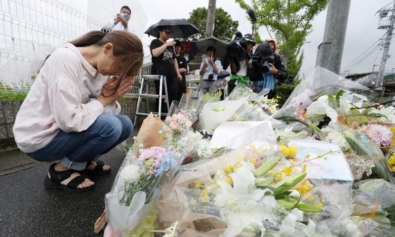 People continued to pay tribute to the victims on Saturday, leaving flowers