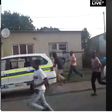 Terrified police officers abandon vehicle, run helter-skelter to avoid lynching by stone throwing mob (video)