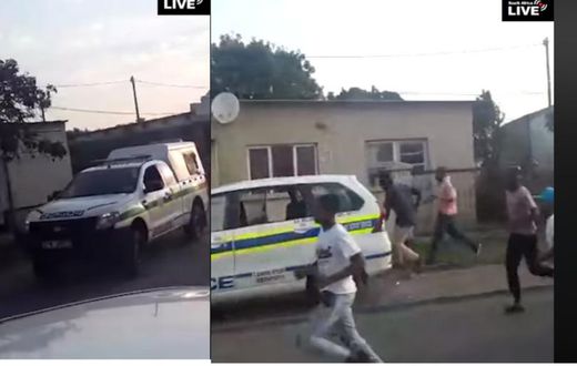 Terrified police officers abandon vehicle, run helter-skelter to avoid lynching by stone throwing mob (video)