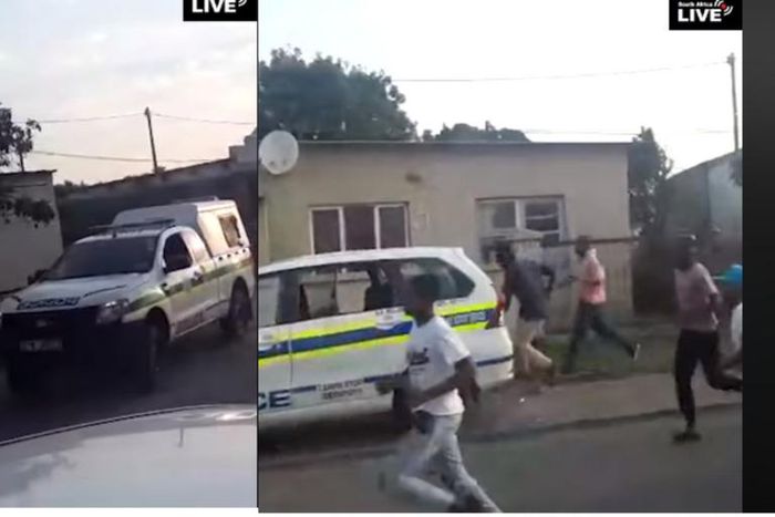 Terrified police officers abandon vehicle, run helter-skelter to avoid lynching by stone throwing mob (video)
