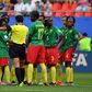Chinese referee Qin Liang awards one of the goals much to the dismay of the Cameroon team