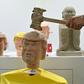 A kiosk at a Shanghai electronics fair is offering visitors the chance to smash a life-sized likeness of Donald Trump with a hammer