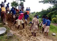 Pupils mould blocks with mud to construct their classroom at Banaso presby school