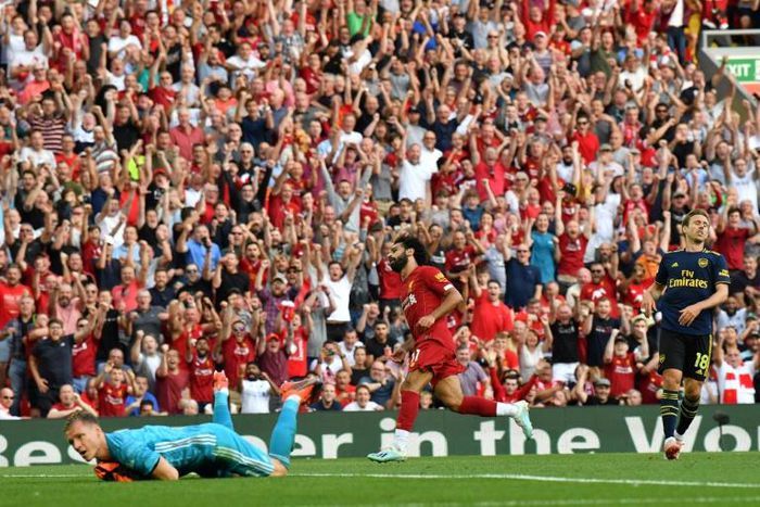 Streaking clear: Mohamed Salah (centre) scored twice in Liverpool's win over Arsenal