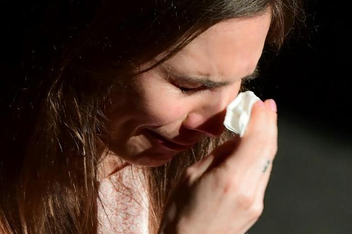 Amanda Knox wipes away tears as she addresses the "Trial by Media" panel in Modena on her first visit back to Italy since her 2015 acquittal for the murder of fellow exchange student Meredith Kercher