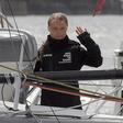 Swedish climate activist Greta Thunberg waves from aboard the Malizia II IMOCA class sailing yacht which is taking her to New York