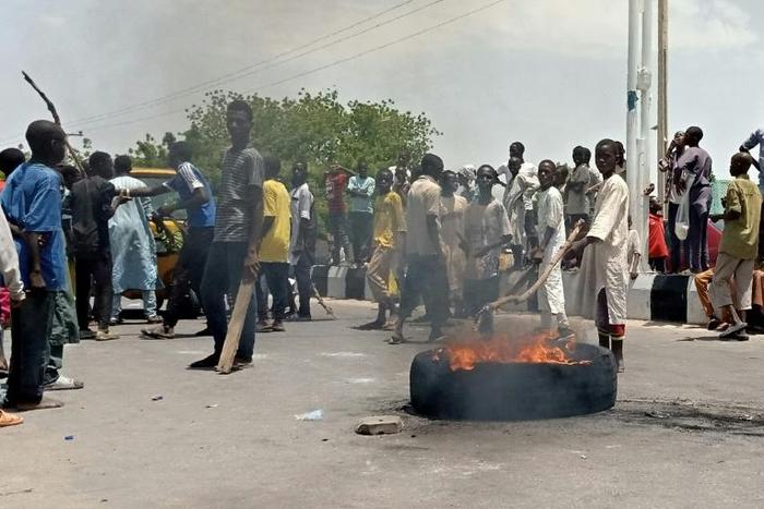 Protesters block a main road in the northern Nigerian city of Maiduguri, demanding the authorities ban a local anti-Boko Haram militia they say is abusing them