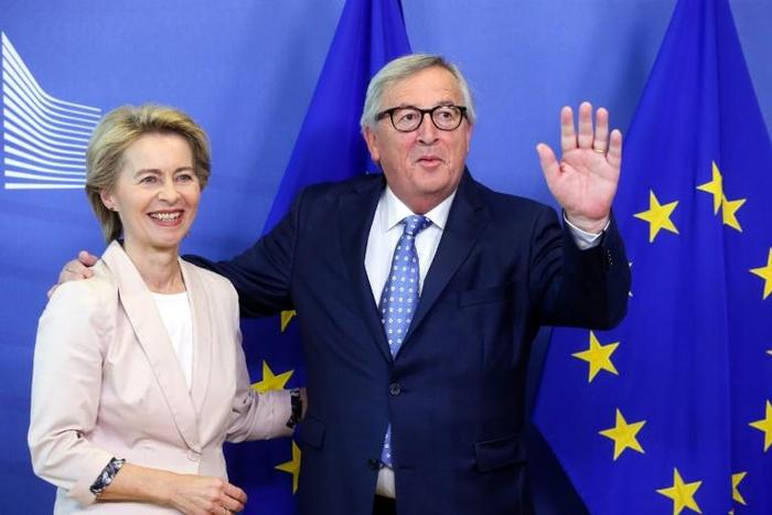 Outgoing president of the European Commission Jean-Claude Juncker (right) welcomes his successor, German Defence Minister Ursula von der Leyen in Brussels