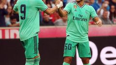Eden Hazard celebrates scoring with teammate Karim Benzema
