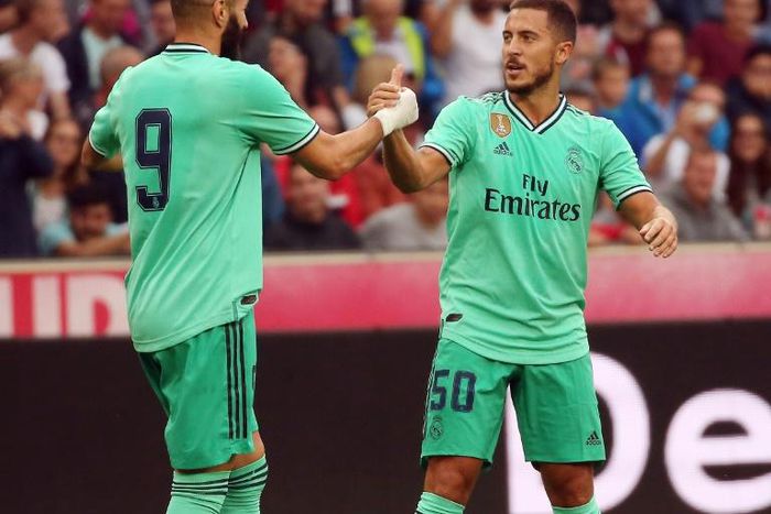 Eden Hazard celebrates scoring with teammate Karim Benzema