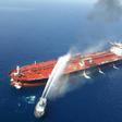 This file picture obtained by AFP from Iranian news agency Tasnim on June 13, 2019 reportedly shows an Iranian navy boat trying to control fire from Norwegian owned Front Altair tanker after it was attacked in the Gulf of Oman