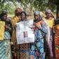 Parents and relatives hold pictures of girls missing since they were abducted by Boko Haram on April 14, 2014 in Chibok, northern Nigeria