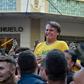 Brazil's then-presidential candidate Jair Bolsonaro grimaces after being stabbed during a campaign rally in Juiz de Fora, in southern Brazil, on September 6, 2018