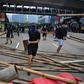Thousands of demonstrators, many wearing hard hats and gas masks, marched through the industrial Kwun Tong area, where they were blocked by dozens of riot police with shields and batons