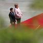 German Chancellor Angela Merkel visibly trembled for minutes while standing in the midday sun next to Ukrainian President Volodymyr Zelensky