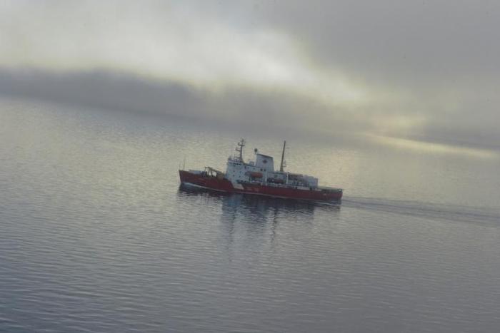 A Canadian research ice-breaker navigating in an ice-free passage through the Arctic Ocean in 2015