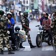 India has imposed a security clampdown on Kashmir and is rushing a bill through parliament to scrap the region's special status