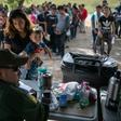 A US Border Patrol agent interviews immigrants after taking them into custody on July 02, 2019 in Los Ebanos, Texas