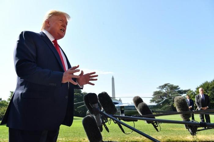 US President Donald Trump speaks to the press on the South Lawn of the White House before departing in Washington, DC on August 9, 2019.US President Donald Trump departed the White House for fundraisers in New York before going to his summer holidays i...