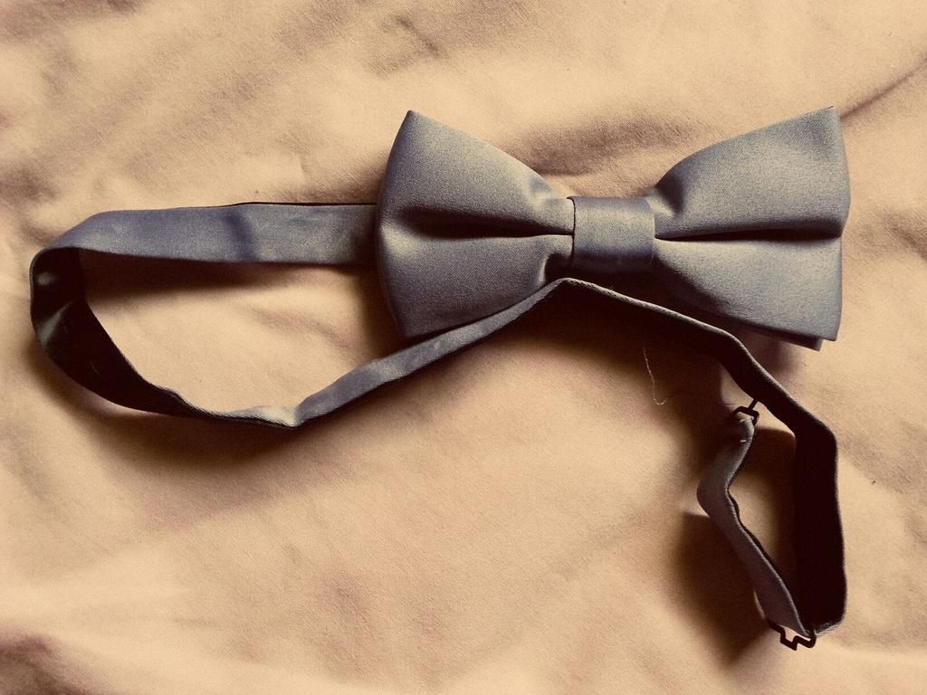 Black Bowtie On Beige Blanket