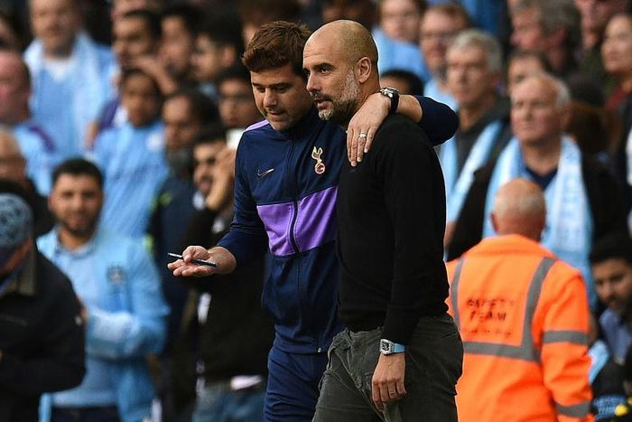 Spoils shared: Mauricio Pochettino (left) and Pep Guardiola (right) embrace after Manchester City and Tottenham drew 2-2 on Saturday