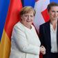 German Chancellor Angela Merkel remained seated as national anthems were played at a ceremony with Denmark's new Prime Minister Mette Frederiksen
