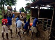 Pupils mould blocks with mud to construct classroom