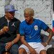 Neymar, pictured here with his father, is yet to return to Paris for pre-season training and on Saturday played in a five-a-side football tournament for his charity Neymar Junior Project Institute near Sao Paulo