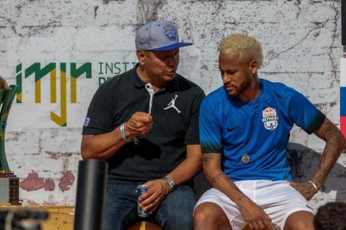 Neymar, pictured here with his father, is yet to return to Paris for pre-season training and on Saturday played in a five-a-side football tournament for his charity Neymar Junior Project Institute near Sao Paulo