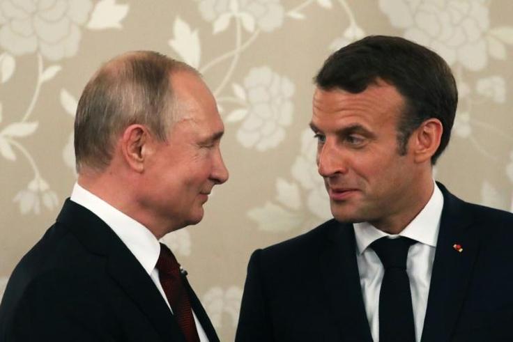 Macron (R) who hosted his Russian counterpart in grand style at the palace of Versailles in 2017, will this time meet Putin at his official holiday residence in Bregancon in southern France